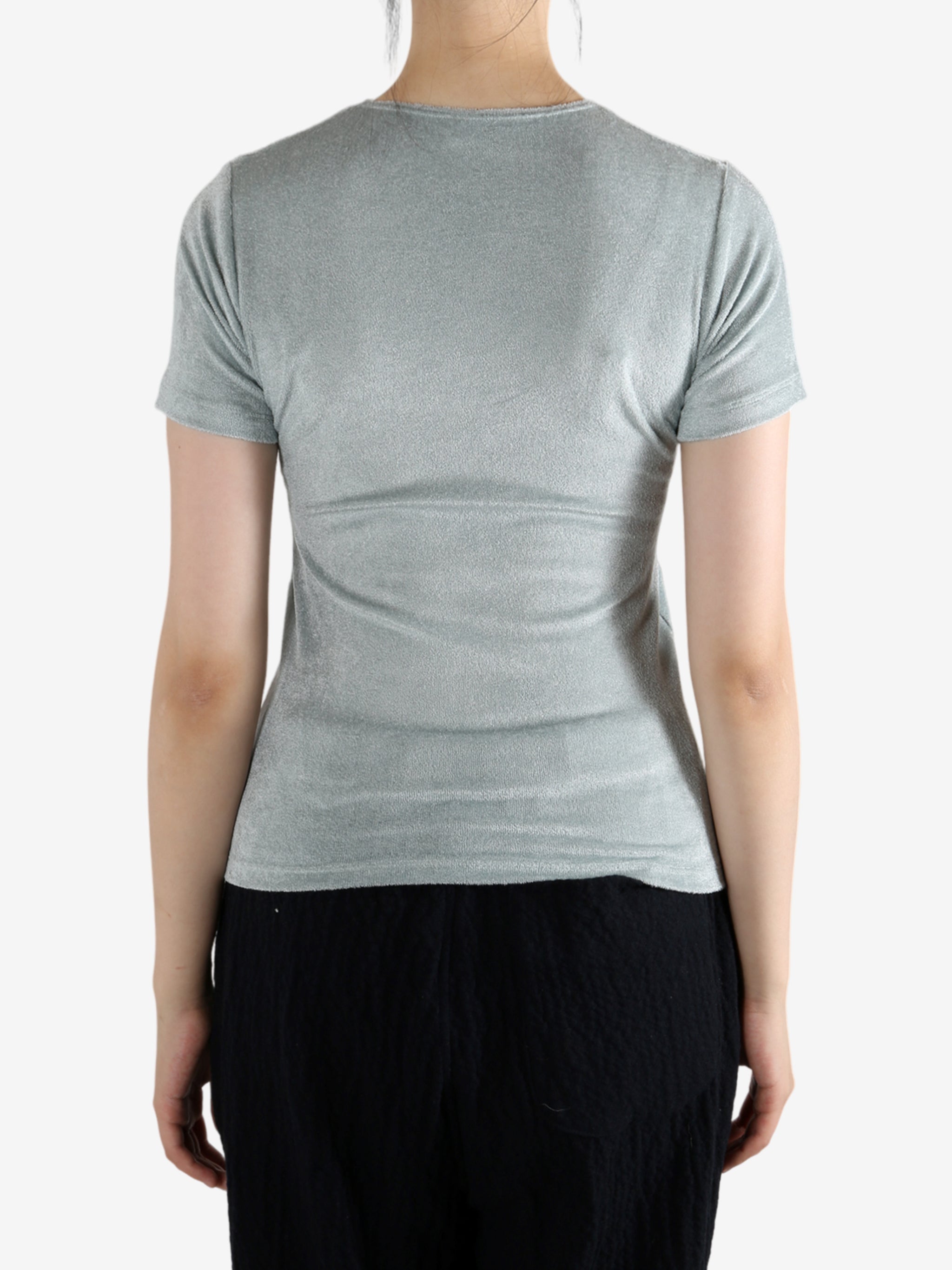 Grey shirt worn by a person, showing the shirt's fit