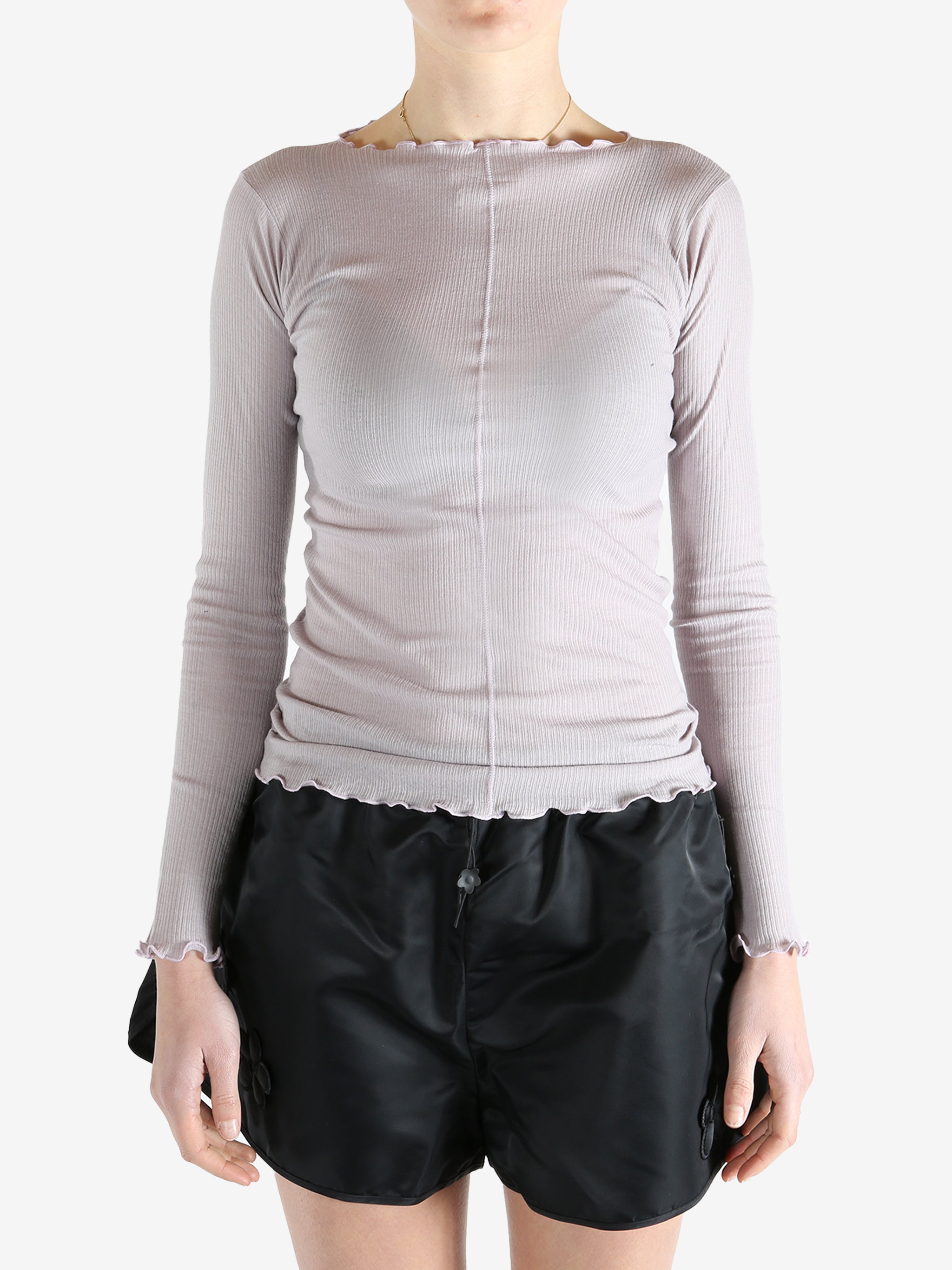 Purple t-shirt worn by a person, showing the shirt's fit