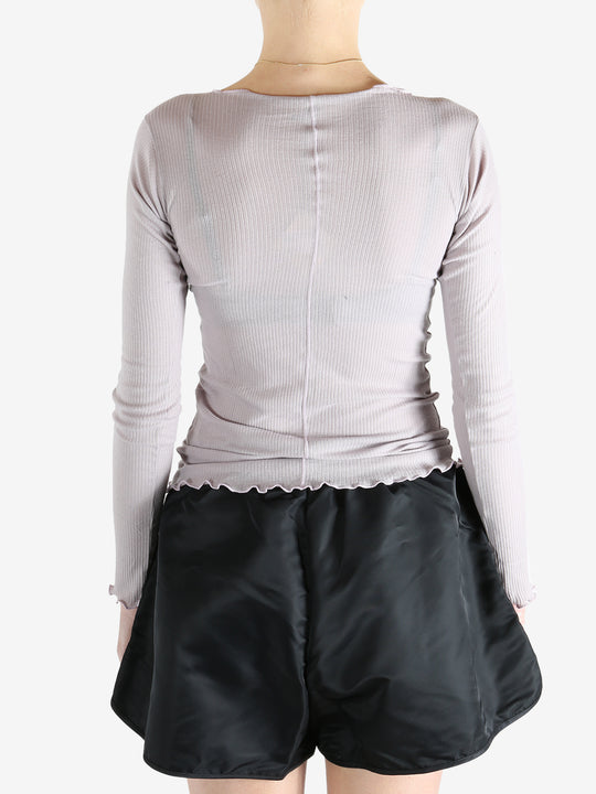 Purple t-shirt worn by a person, showing the shirt's fit