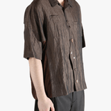 Brown shirt worn by a person, showing the  shirt fit