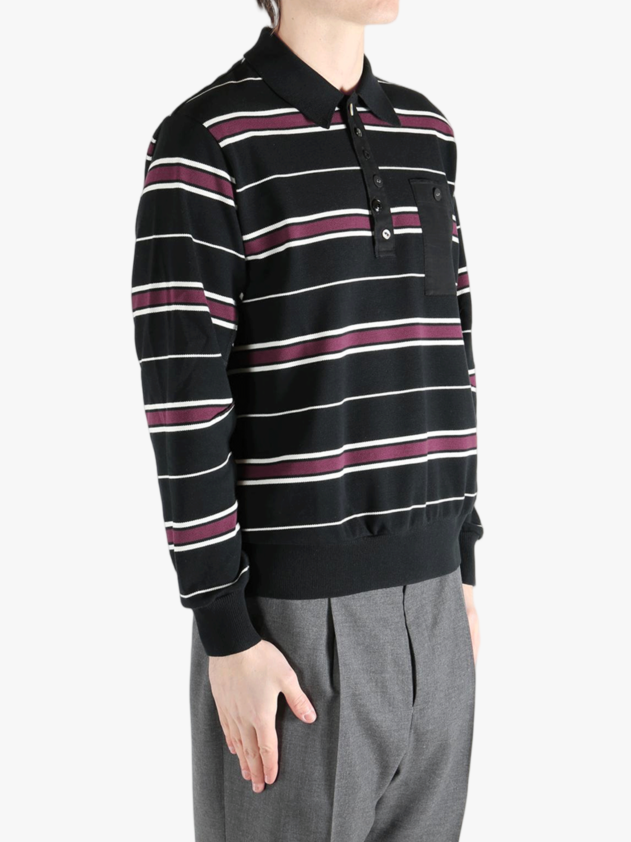 Black t-shirt worn by a person, showing the shirt's fit