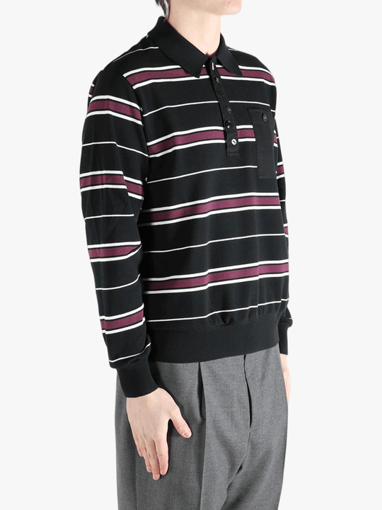 Black t-shirt worn by a person, showing the shirt's fit