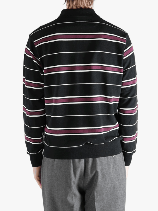 Black t-shirt worn by a person, showing the shirt's fit