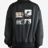 Black coat worn by a person, showing the coat's fit