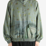 Grey jacket worn by a person, showing the jacket's fit