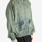 Grey jacket worn by a person, showing the jacket's fit