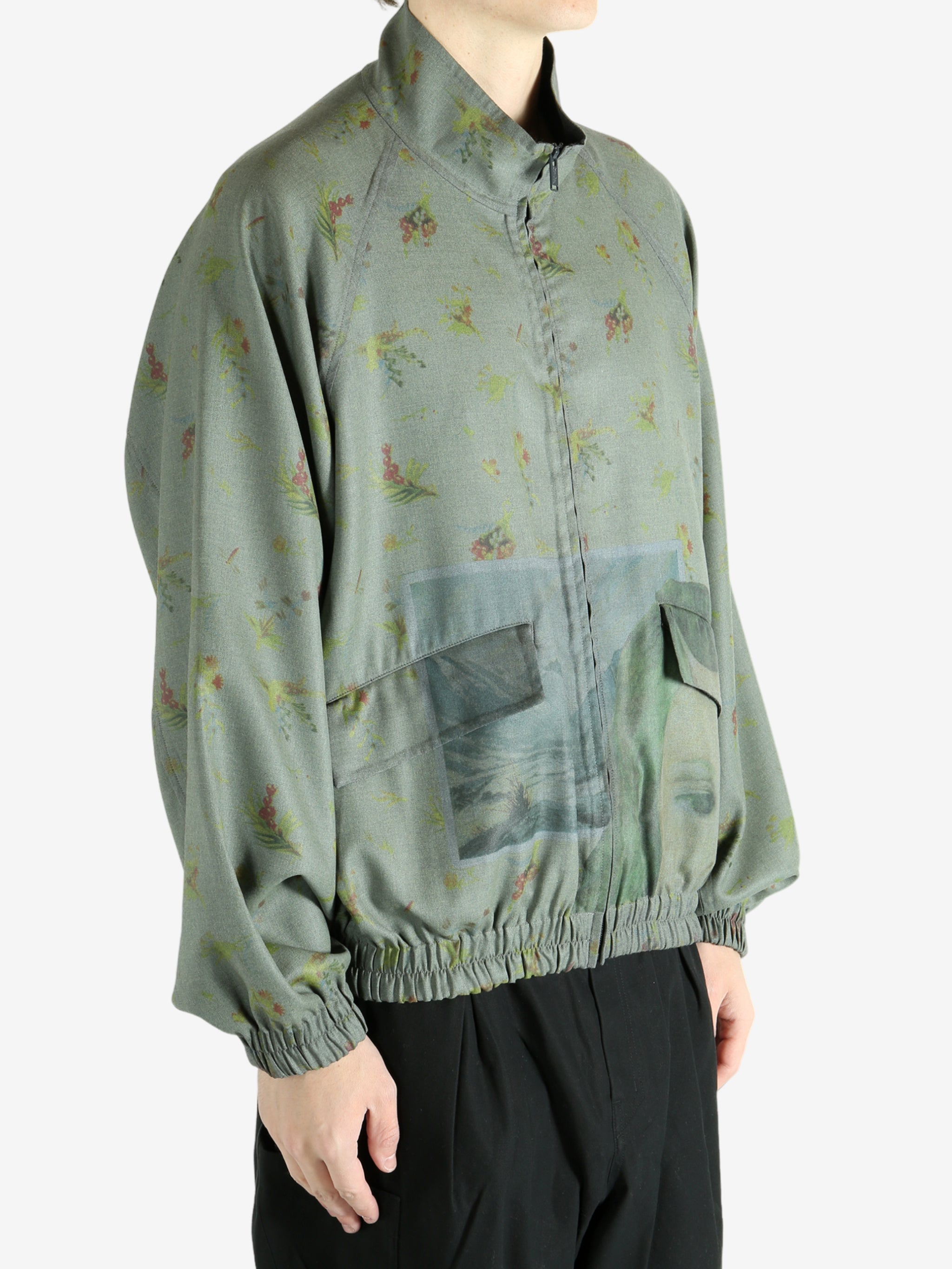 Grey jacket worn by a person, showing the jacket's fit