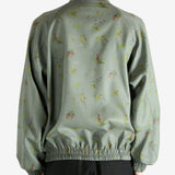 Grey jacket worn by a person, showing the jacket's fit