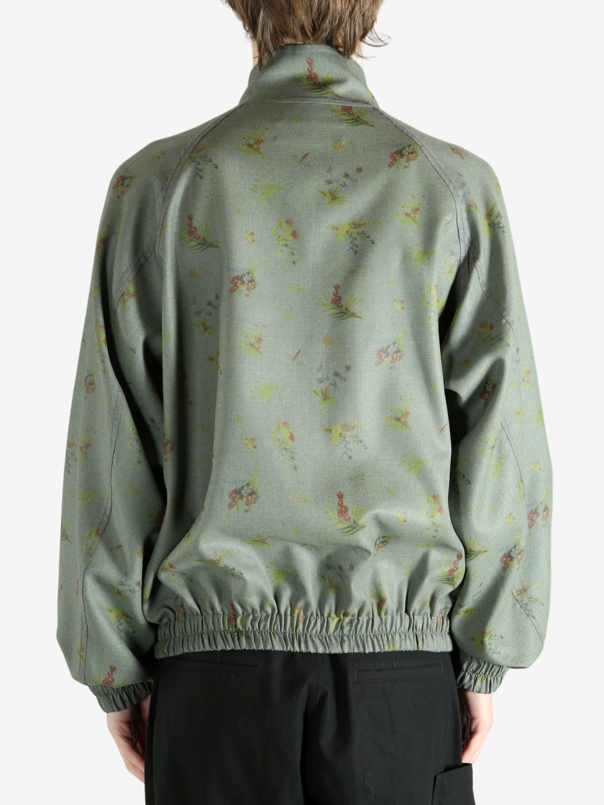 Grey jacket worn by a person, showing the jacket's fit