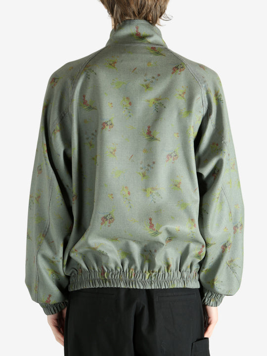 Grey jacket worn by a person, showing the jacket's fit