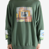 Green top worn by a person, showing the top's fit