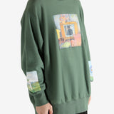 Green top worn by a person, showing the top's fit