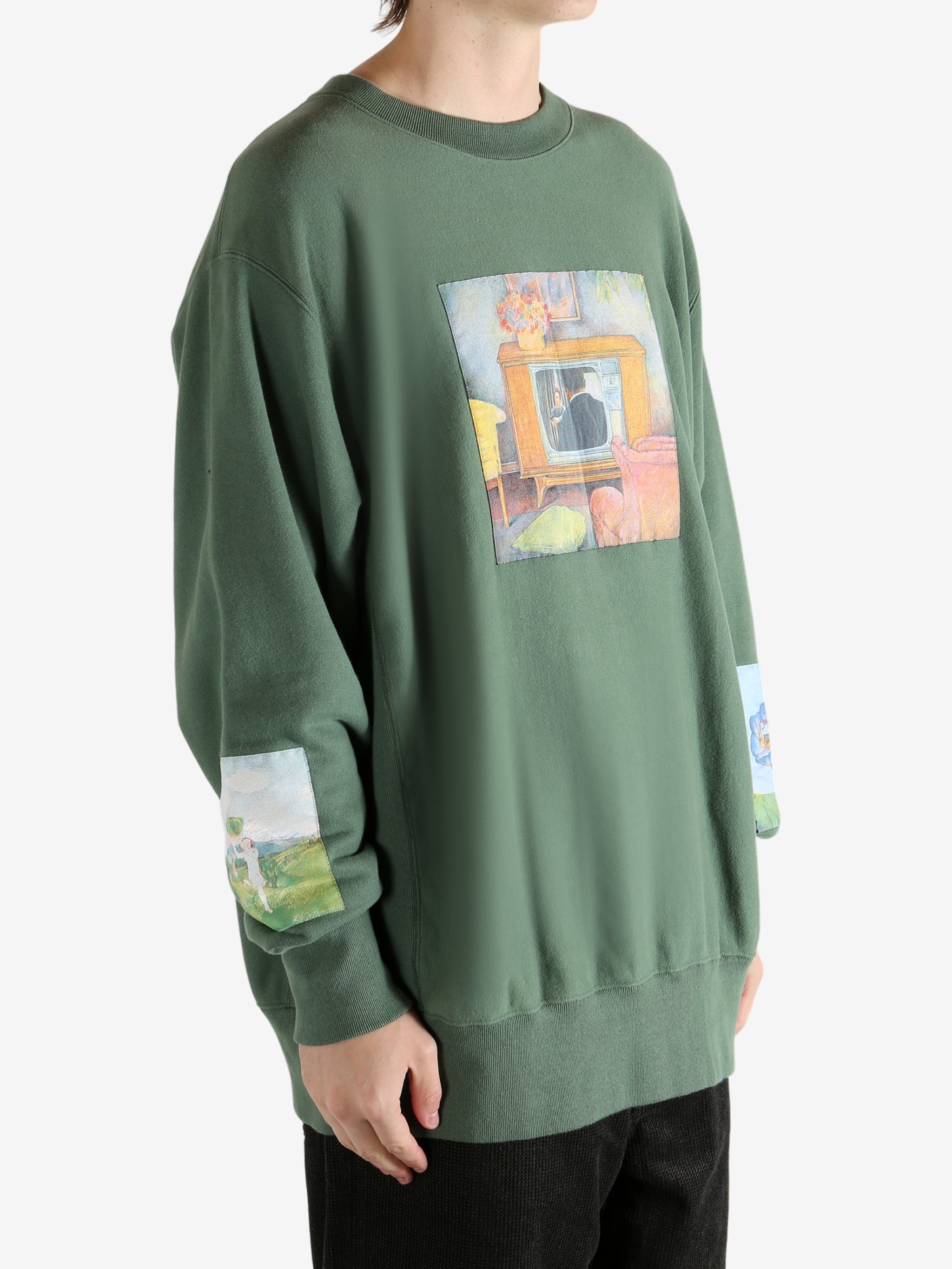 Green top worn by a person, showing the top's fit