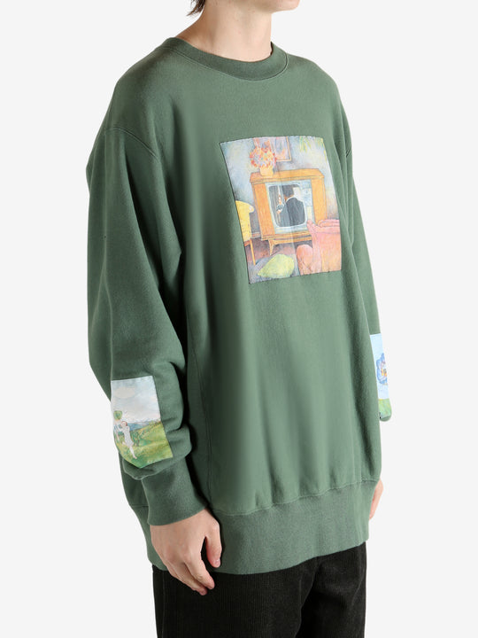 Green top worn by a person, showing the top's fit