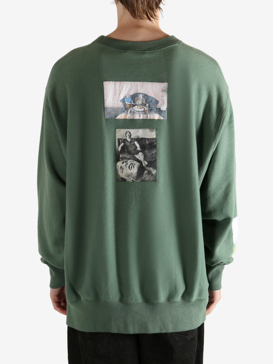 Green top worn by a person, showing the top's fit