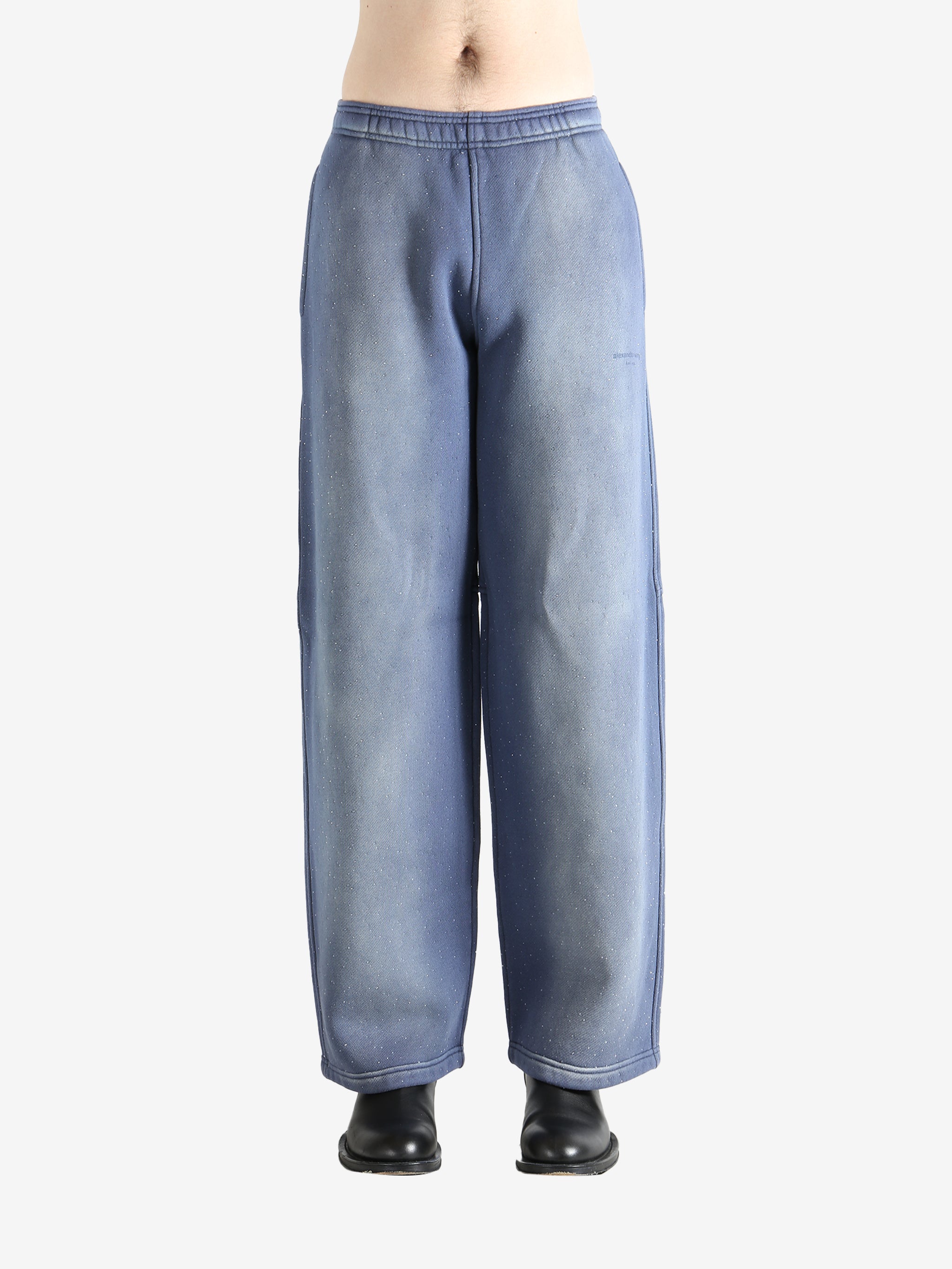 Navy pants worn by a person, showing the pants' fit