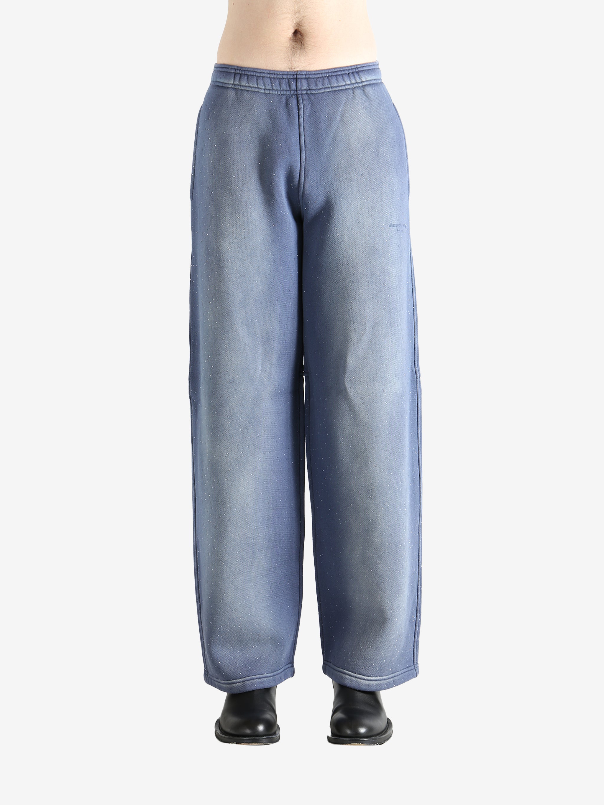 Navy pants worn by a person, showing the pants' fit