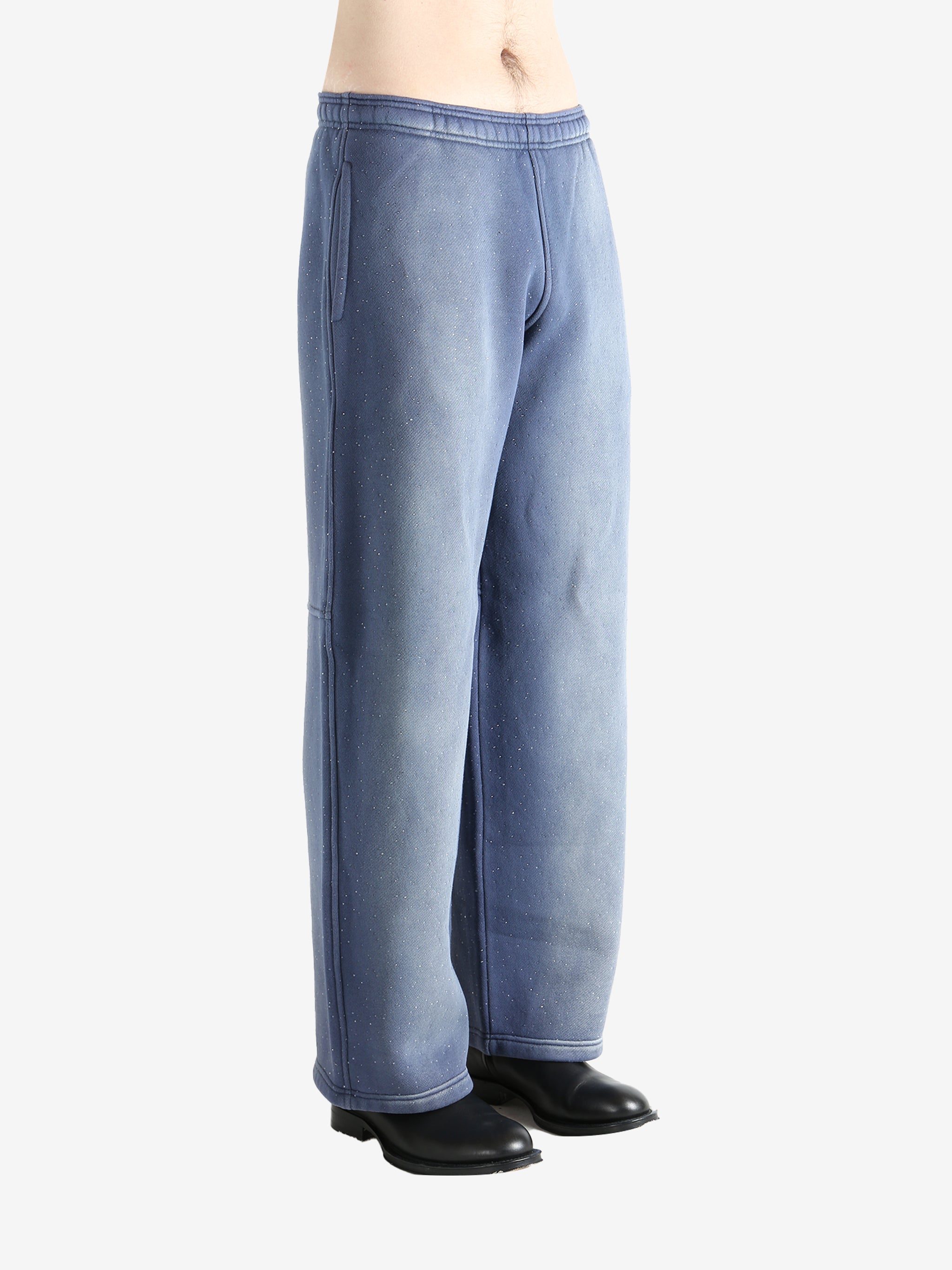 Navy pants worn by a person, showing the pants' fit