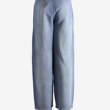 Navy pants worn by a person, showing the pants' fit