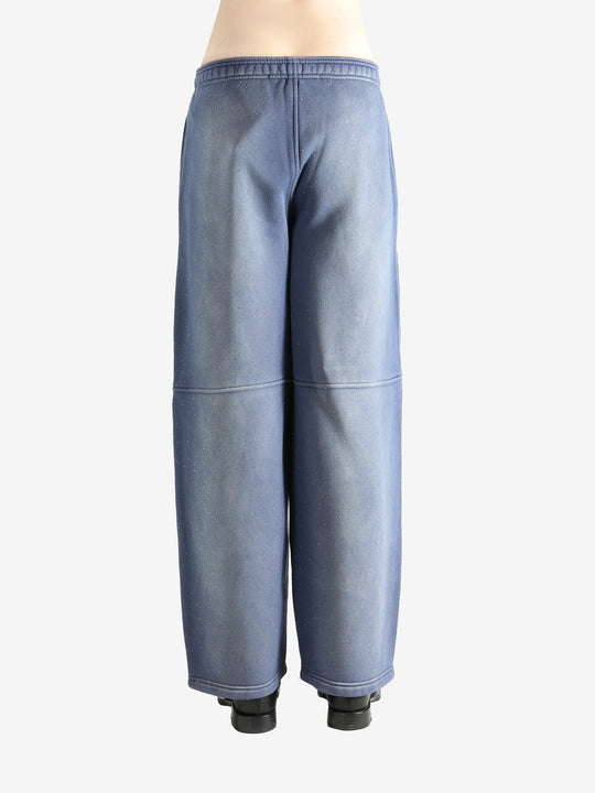 Navy pants worn by a person, showing the pants' fit