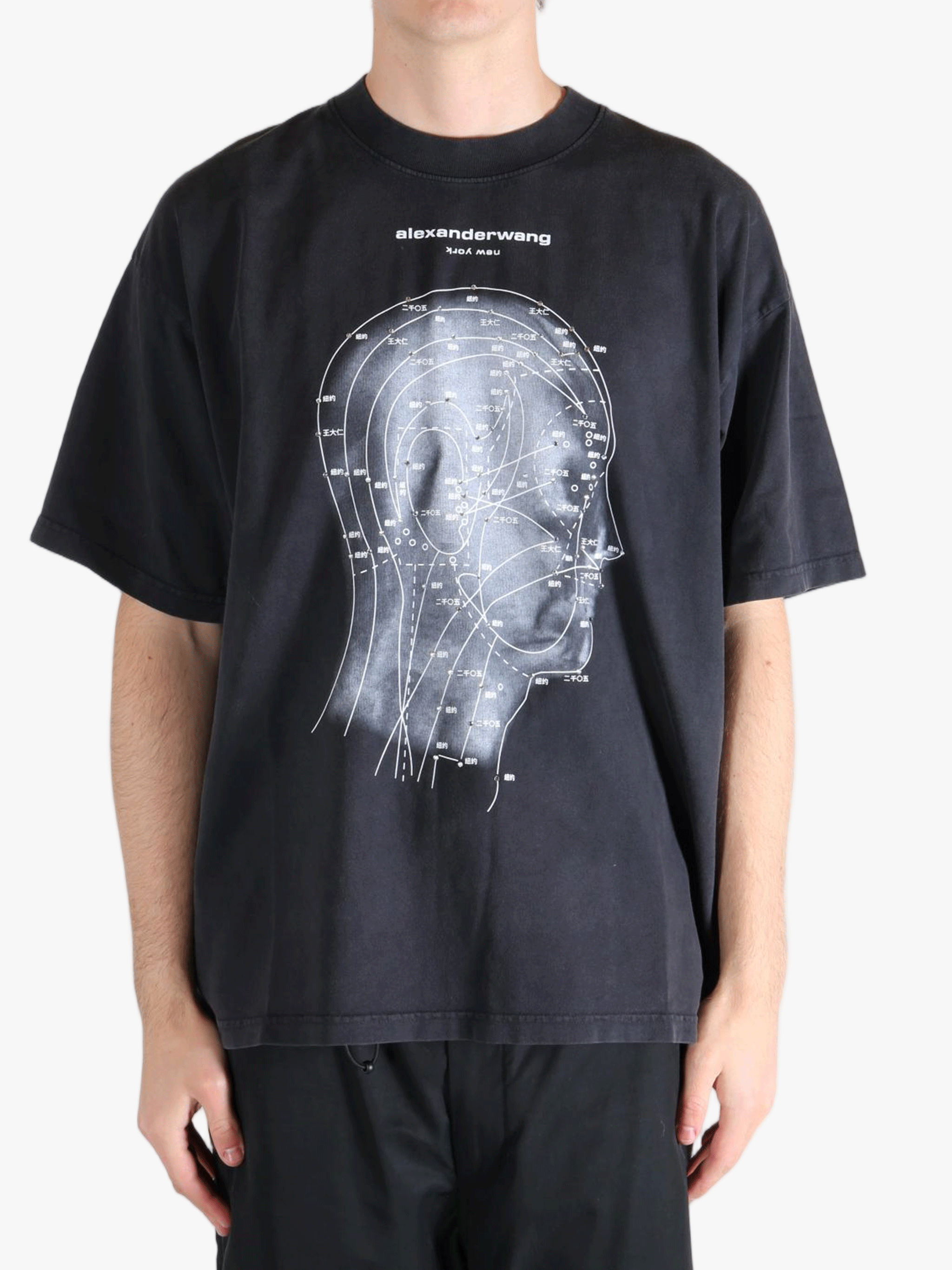 Black t-shirt worn by a person, showing the t-shirt's fit