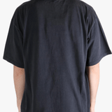 Black t-shirt worn by a person, showing the t-shirt's fit