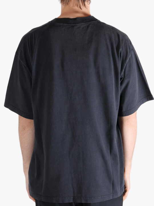 Black t-shirt worn by a person, showing the t-shirt's fit