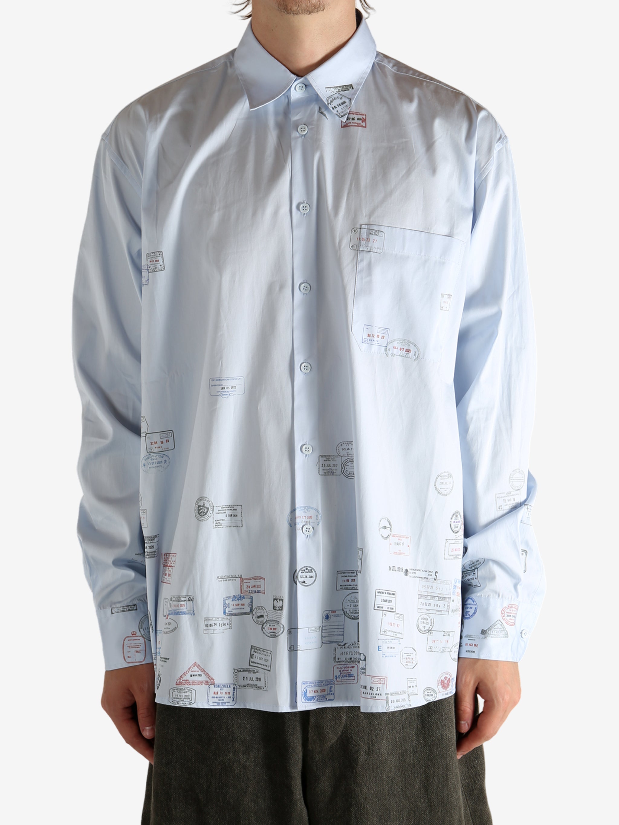 White shirt worn by a person, showing the shirt's fit