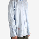 White shirt worn by a person, showing the shirt's fit