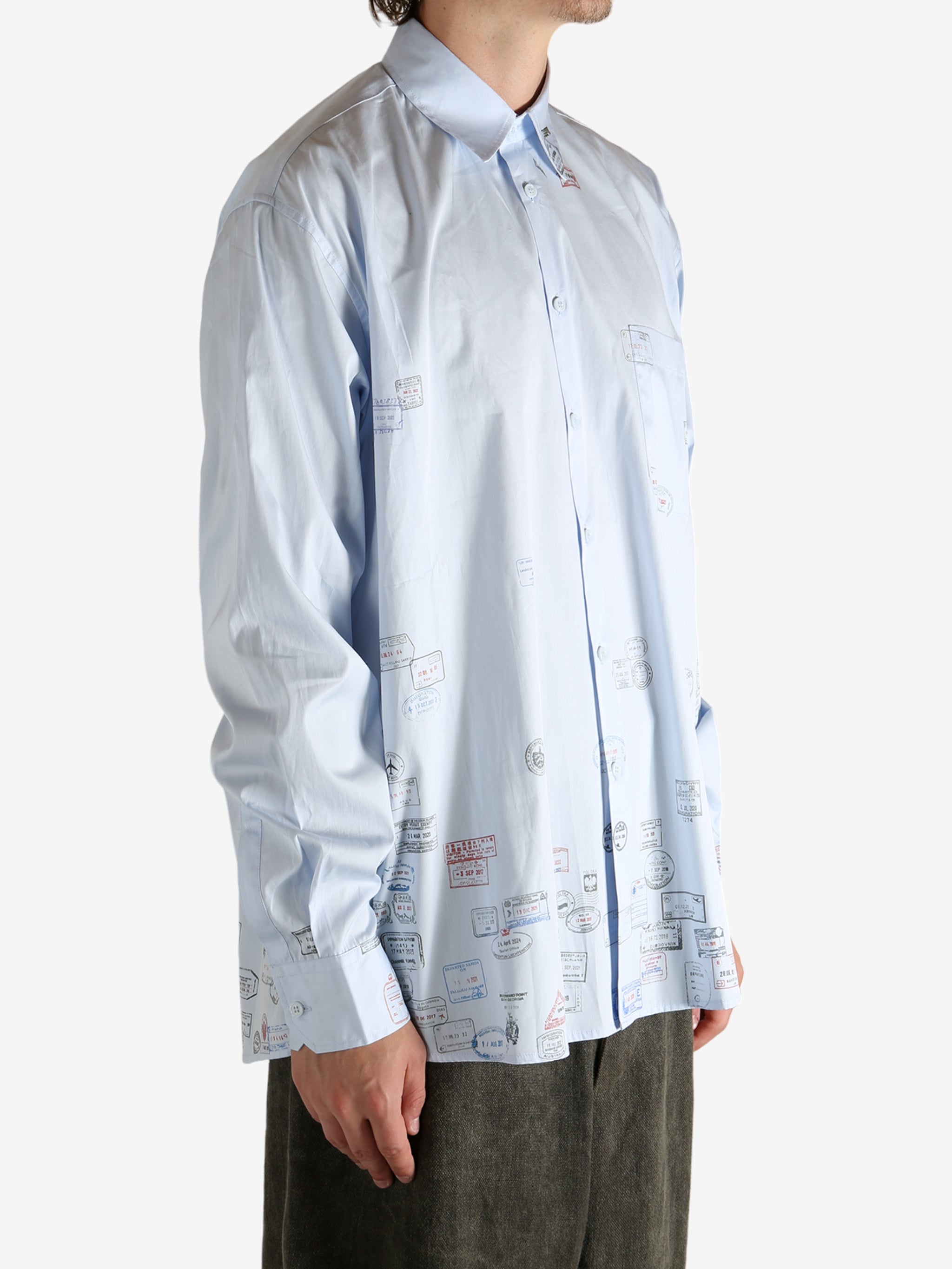 White shirt worn by a person, showing the shirt's fit