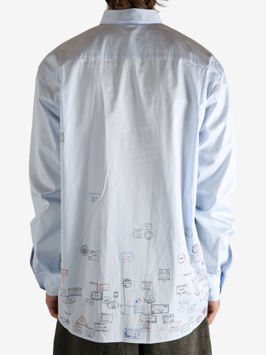 White shirt worn by a person, showing the shirt's fit