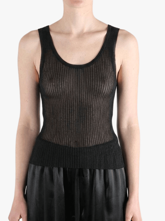 Black top worn by a person, showing the top fit