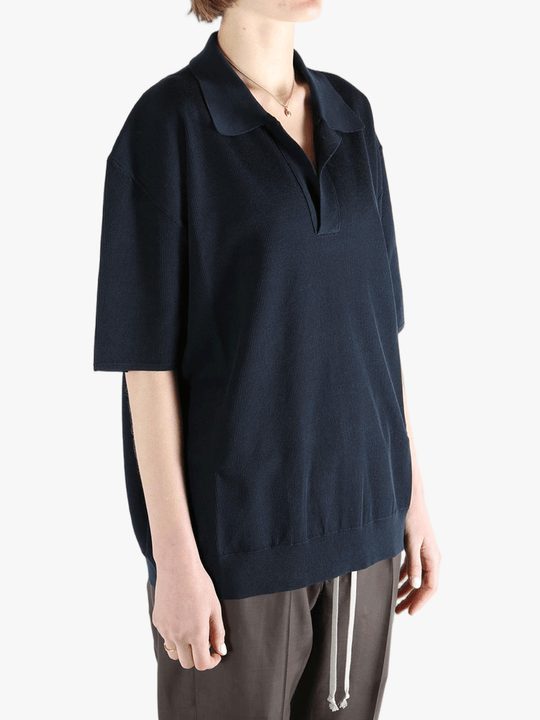 Black top  worn by a person, showing the top 's fit