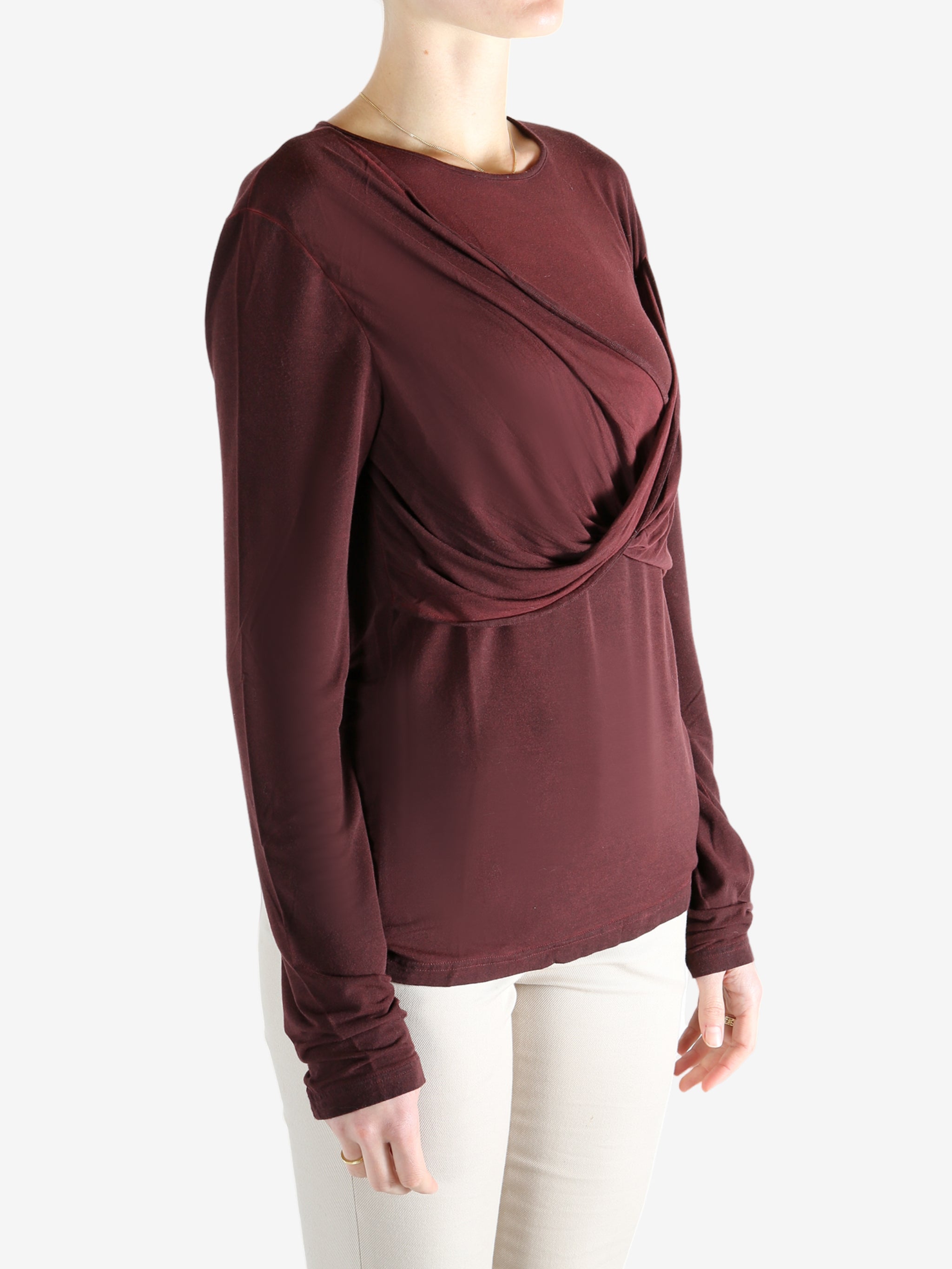 Red knitwear worn by a person, showing the knitwear's fit