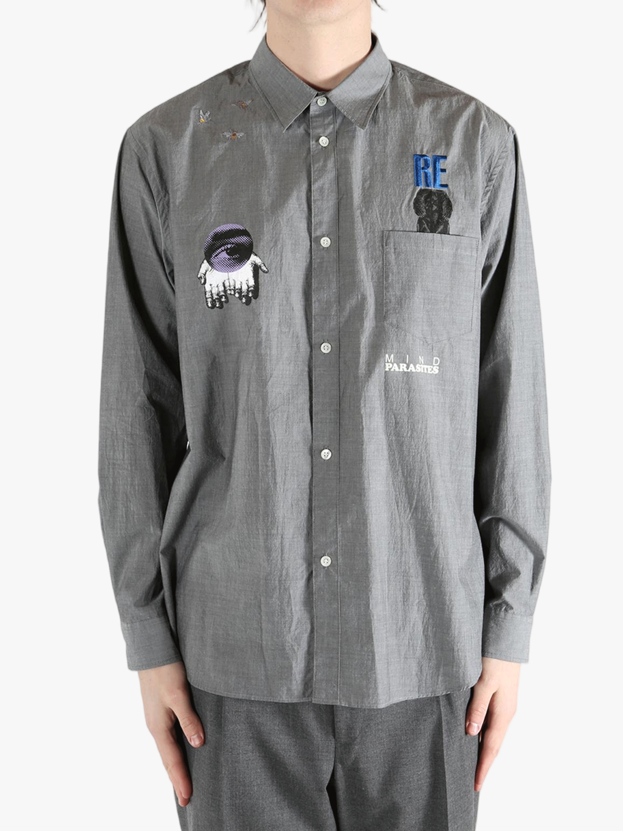 Grey shirt worn by a person, showing the shirt's fit