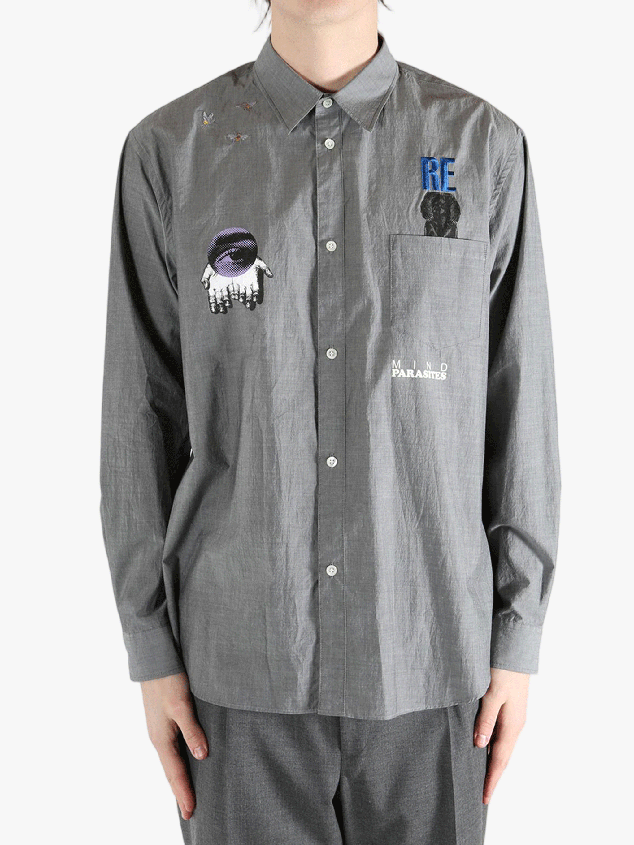 Grey shirt worn by a person, showing the shirt's fit