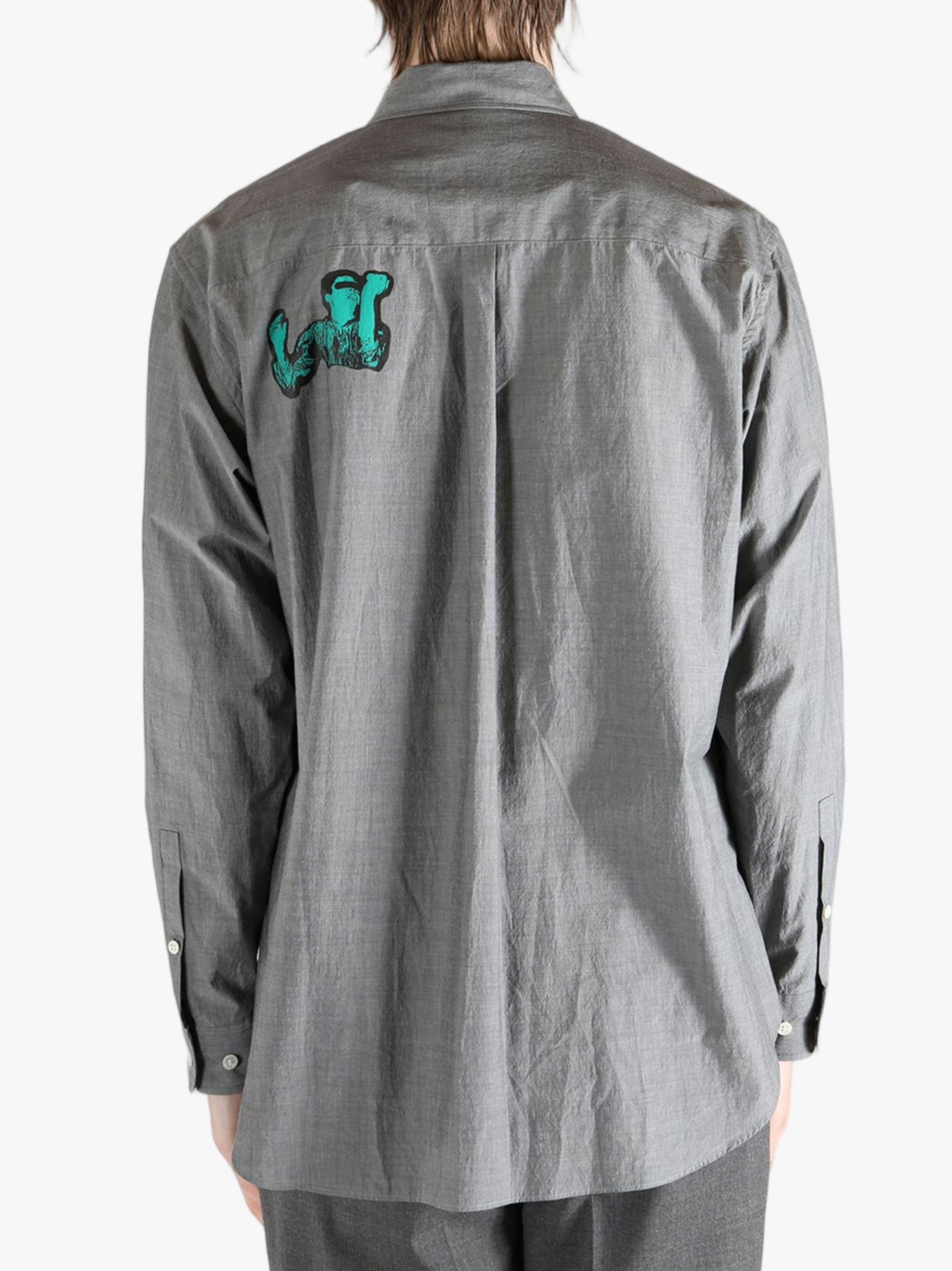 Grey shirt worn by a person, showing the shirt's fit