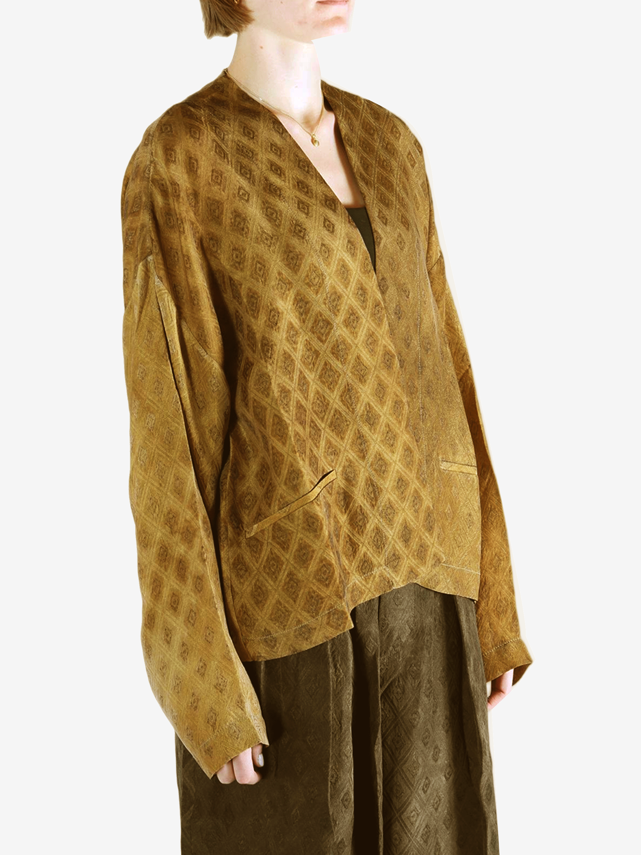 Yellow coat  worn by a person, showing the coat 's fit