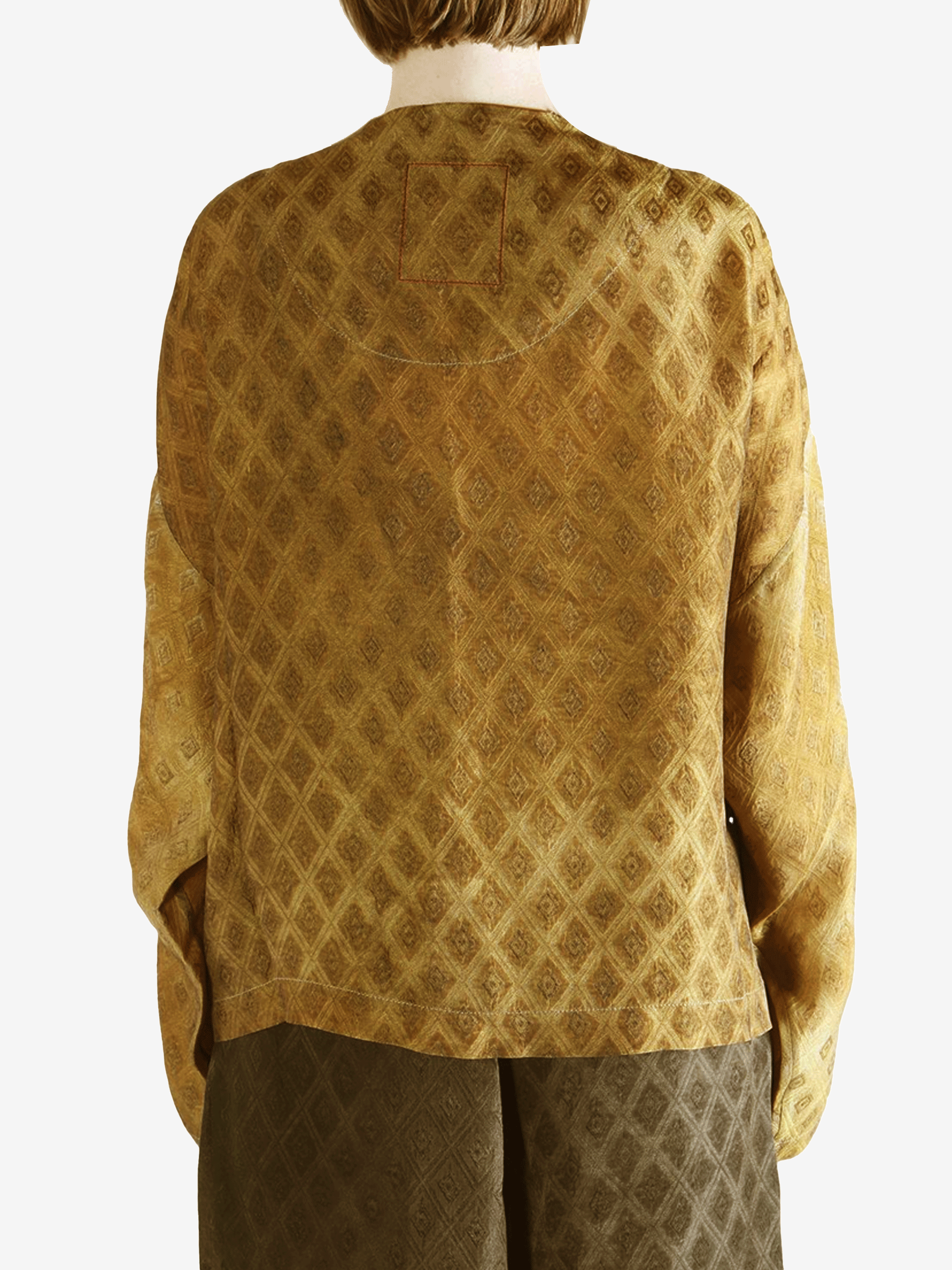 Yellow coat  worn by a person, showing the coat 's fit