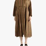 Brown coats worn by a person, showin the coats' fit