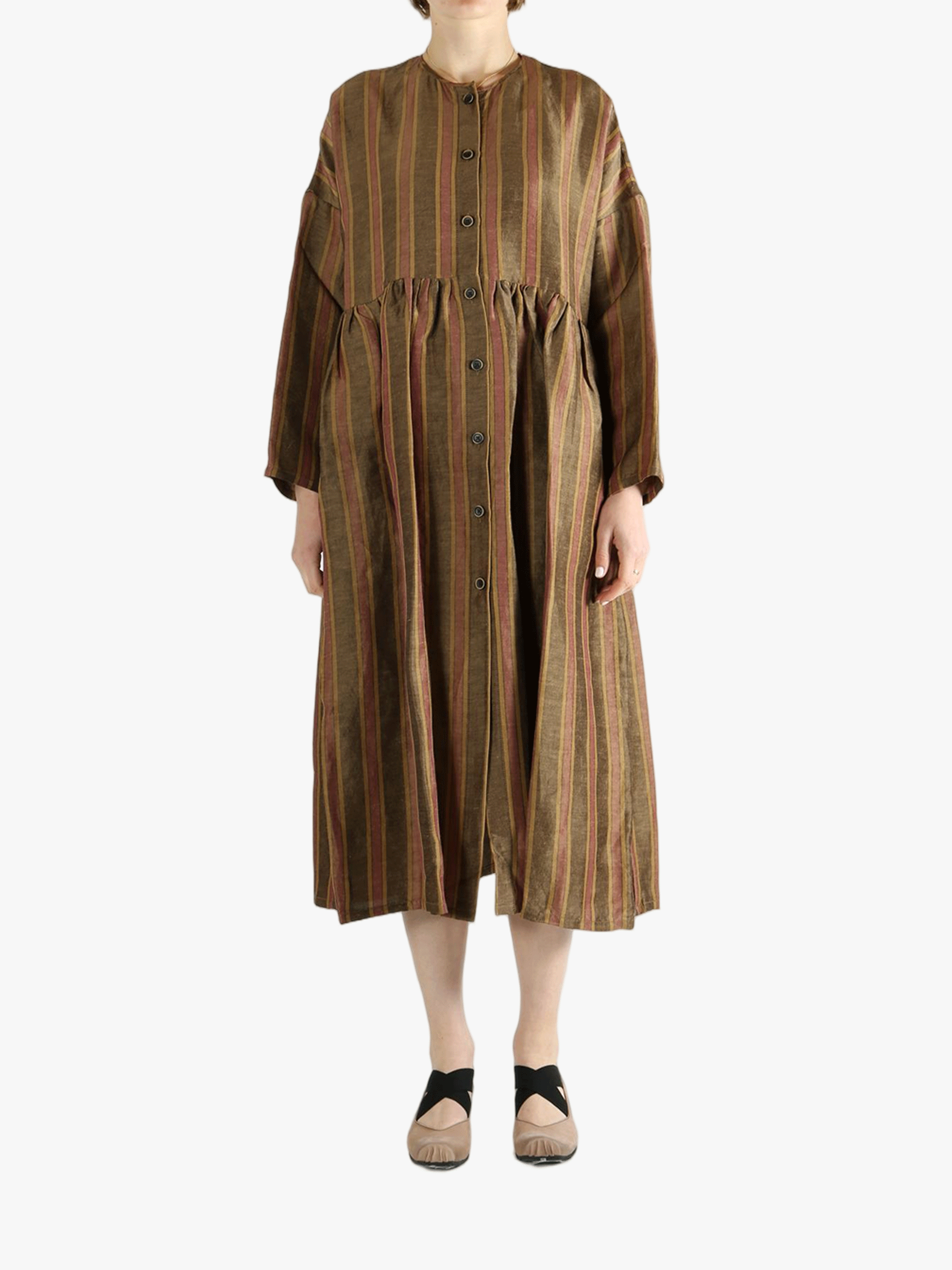 Brown coats worn by a person, showin the coats' fit