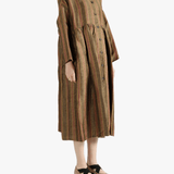 Brown coats worn by a person, showin the coats' fit