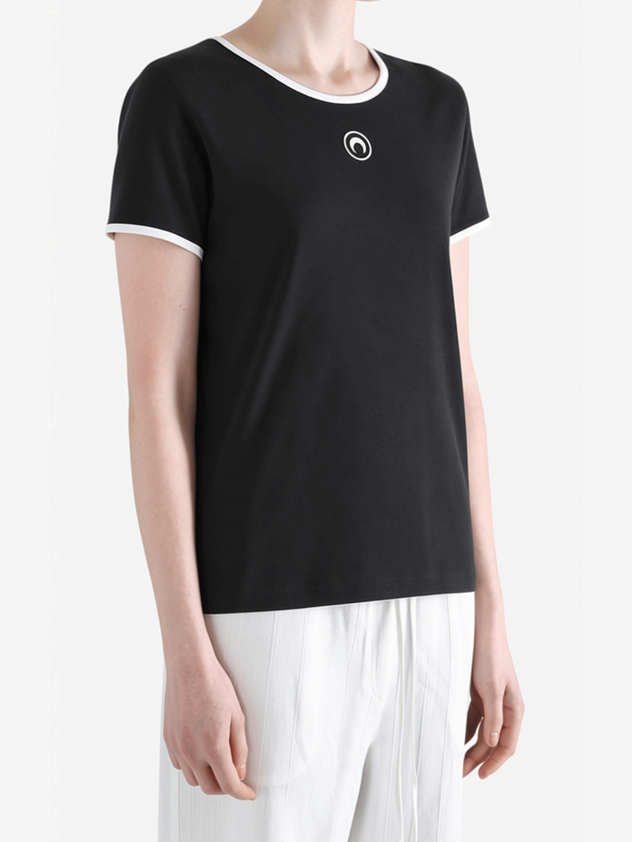 Black t-shirt worn by a person, showing the t-shirt fit