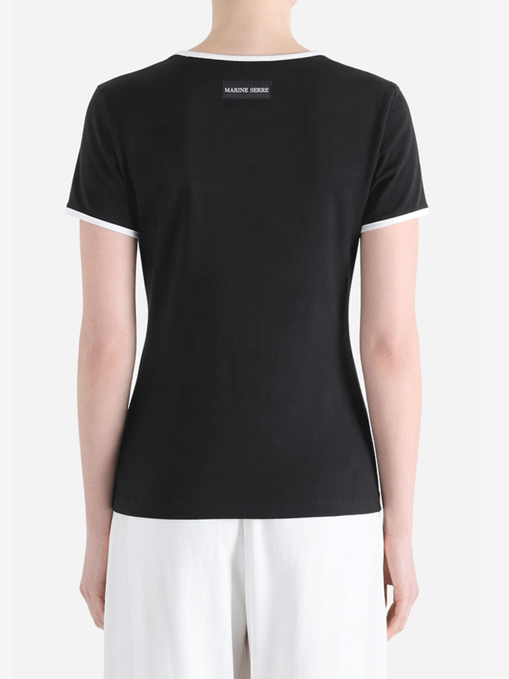 Black t-shirt worn by a person, showing the t-shirt fit