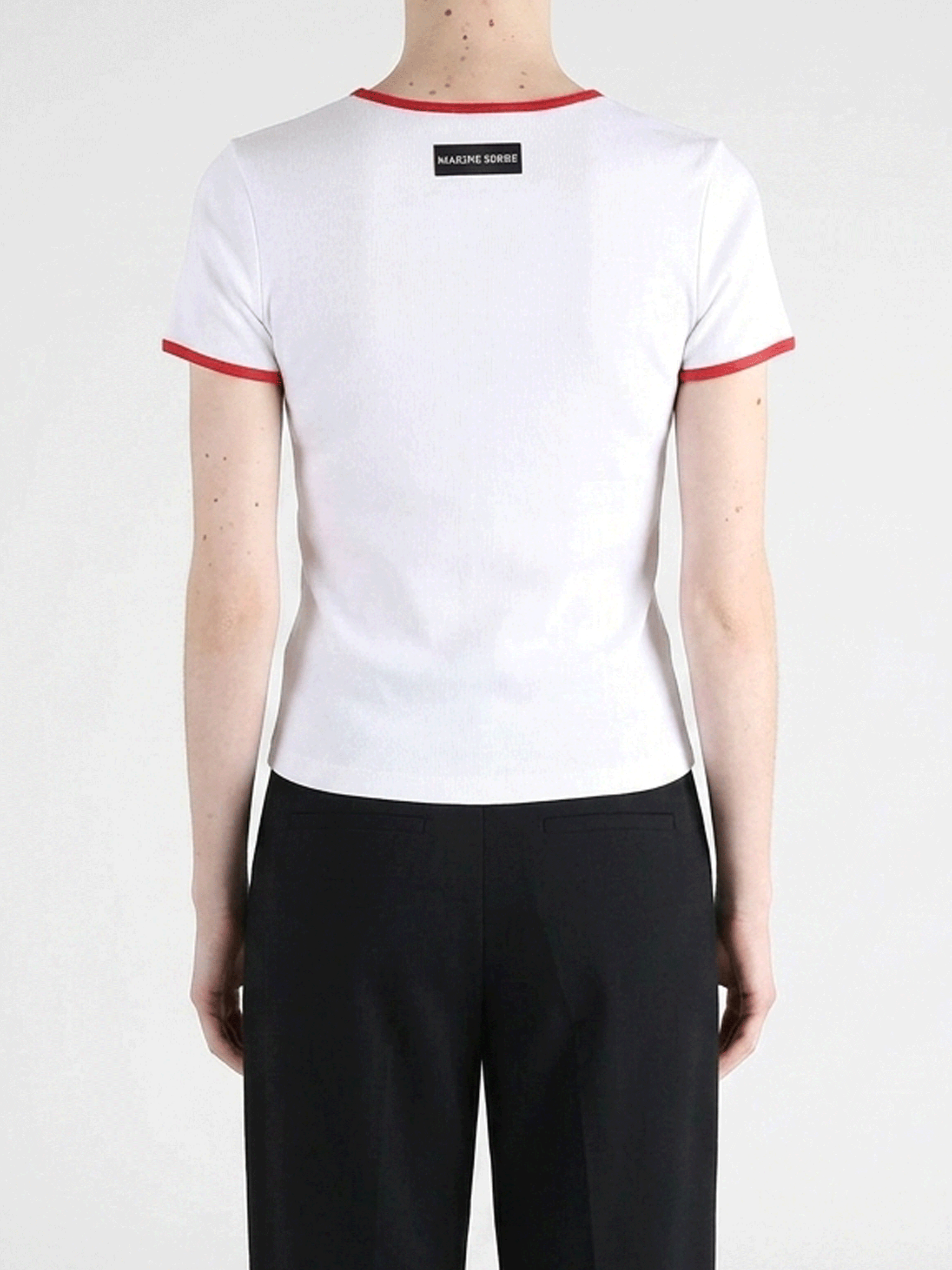 White t-shirts worn by a person, showing the t-shirts fit