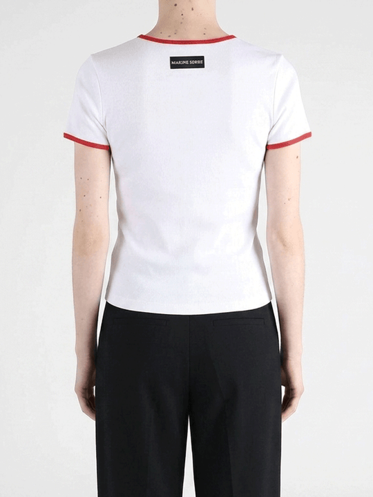White t-shirts worn by a person, showing the t-shirts fit