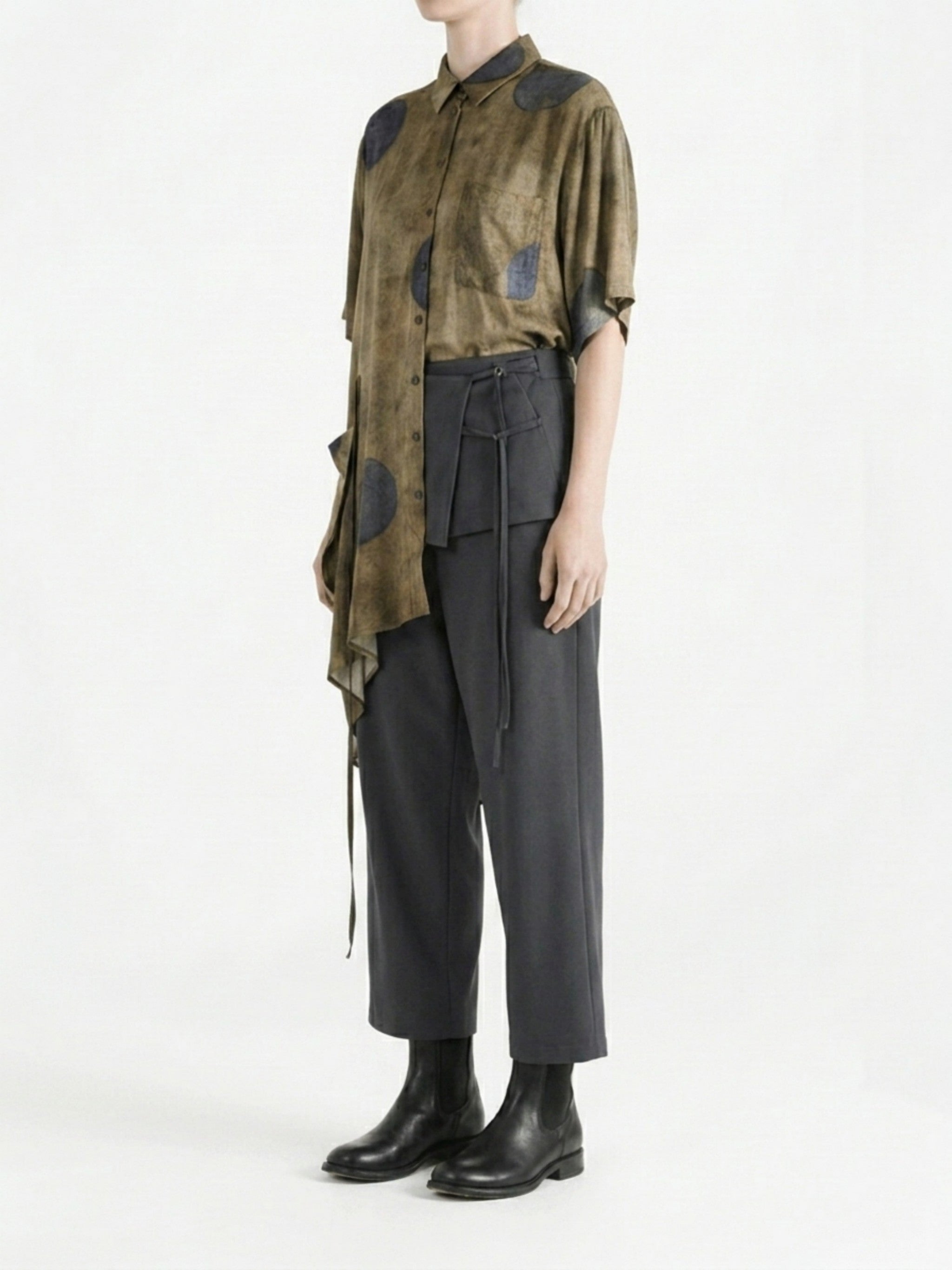 Brown top worn by a person, side view