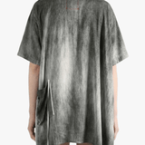 Grey top worn by a person, back view