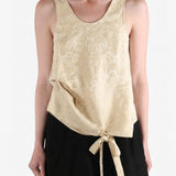 Tan tops worn by a person, showing the tops fit