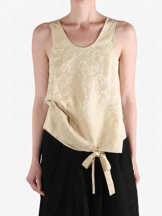Black top worn by a person, showing the top fit